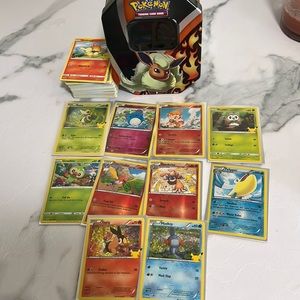 Pokemon TCG 100 card lot with holos and metal tin included